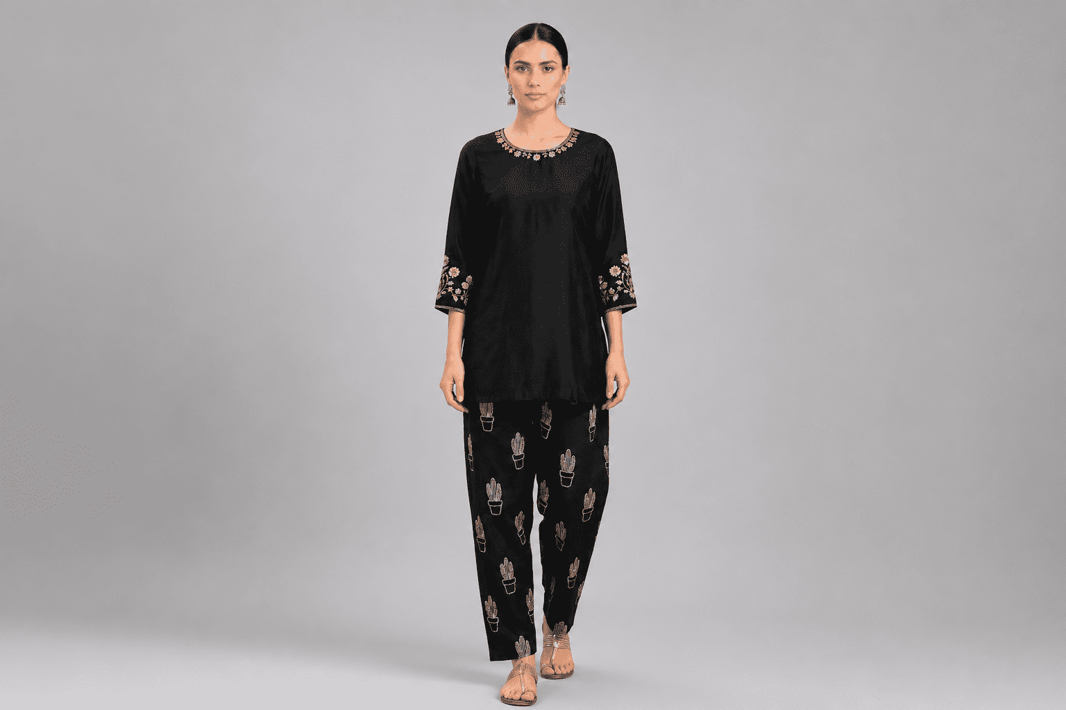 Black Embroidered Kurta with White Floral Printed Trousers for Women